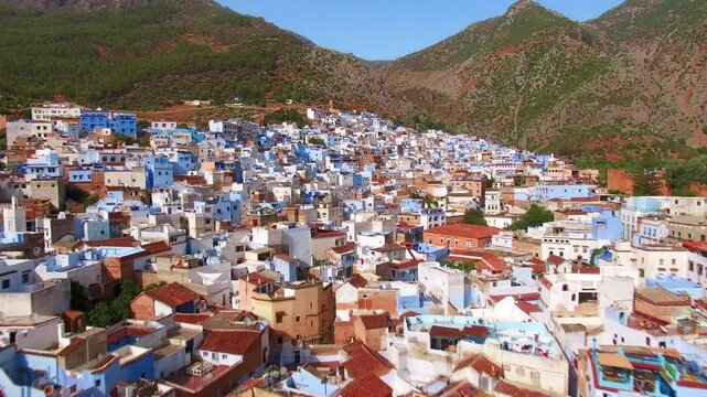 Explore Chefchaouen, the Blue City of Morocco, from above and take in its beauty among the Rif Mountains. The vibrant culture and azure buildings make it an enchanting destination