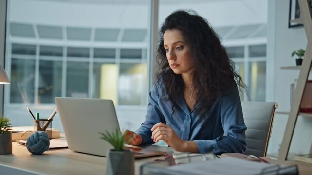 Sad employee receiving email while taking notes. Closeup disappointed woman