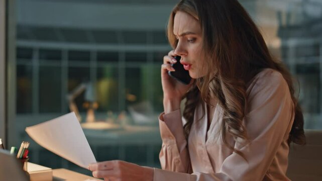 Anxious businesswoman discussing problem on call closeup. Angry woman talking