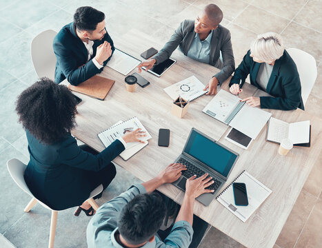 Business people, meeting and paper with charts for sales planning, portfolio and company report. Top view, digital marketing and team with tech in discussion for brainstorming, idea or plan of growth