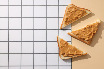 Sandwiches with peanut paste, on a light background.