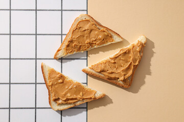 Sandwiches with peanut paste, on a light background.