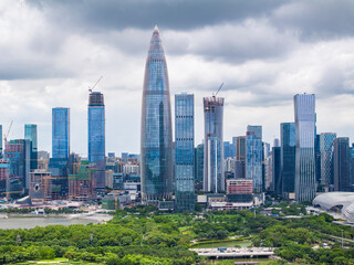 Park in city of Shenzhen China,beautiful mix of green trees combined with buildings, modern architecture, totally blue skies.