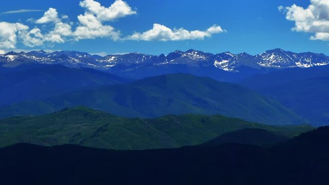 Vail Mount Holy Cross Gore Range Old Snowmass Mount Aspen Roaring Fork River farmland open Space Carbondale summer Colorado aerial drone June July Rocky Mountains snow cap peaks daytime circle right