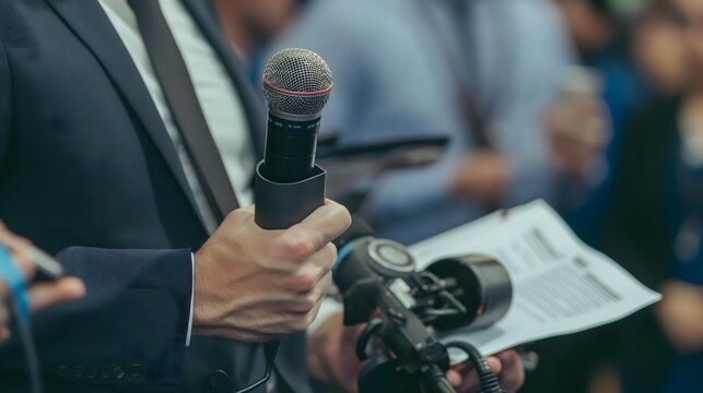 - A public relations specialist managing a media event, with press and promotional materials in view