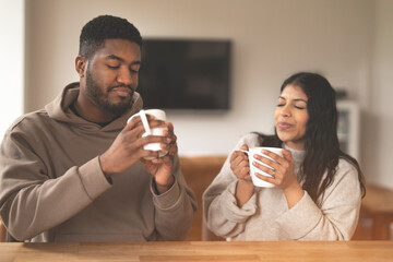 Couple Enjoying Coffee Together in  Cozy Home Setting