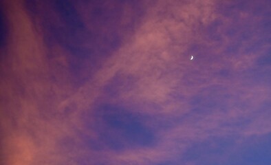 Moon and Colorful Clouds in Evening Sky