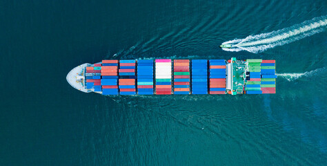 Aerial top view of Cargo container Ship, Cargo vessel ship carrying container and running for import export freight shipping sea freight by express for the international order concept.