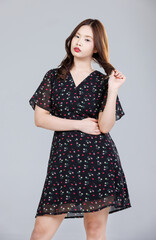 Portrait of Asian cute cheerful young girl wearing small flower pattern color black dress, stylish model woman happy and cool sweet smile posing isolated on white background, Teenage and youth fashion