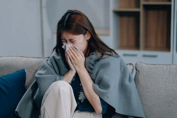 A woman with a cold with pills is treated at home chooses which drugs to take and self-medicates,...