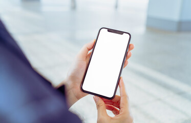 Hand holding smartphone mockup of blank screen, Take your screen to put on advertising.
