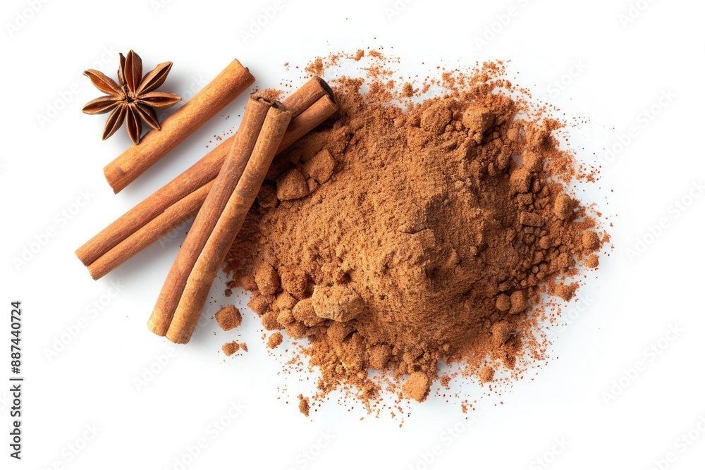 Wall mural A pile of ground cinnamon and anise spices on a clean white surface