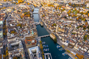 Zurich, Switzerland: Aerial drone view of Zurich city center with the old town and the business district along the Limmat river in autumn in Switzerland largest city.