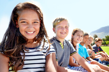 Obraz premium School kids, friends and portrait with smile in garden on academy trip for adventure, learning or summer. Girls, boys and face in park for sunshine or bonding together or nature, relax or countryside