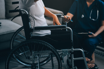 Obraz premium Asian physiotherapist helping elderly woman patient stretching arm during exercise correct with dumbbell in hand during training hand with patient Back problems in garden. Nursing home hospital