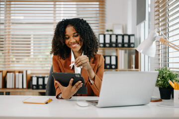  Businesswoman Analyzing Finance on Tablet and Laptop at modern Office Desk tax