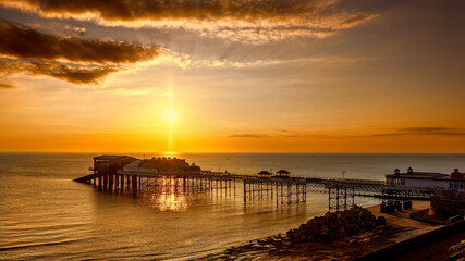Fototapeta premium Aerial view of a sunrise over Cromer pier.