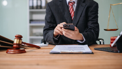 Fototapeta premium Justice and law concept.Male judge in a courtroom on white table and Counselor