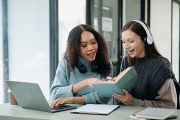 Young woman and woman wearing headphones and doing a live podcast for their channel, communication for radio podcast