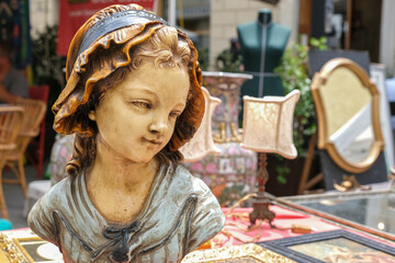 Figurine bust of a young woman on flea market Arezzo Italy