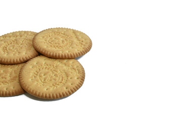 Several pieces of dry cookies lie on a white background.