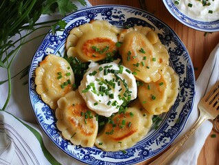 11 Polish pierogi with sour cream and chives bird's-eye view