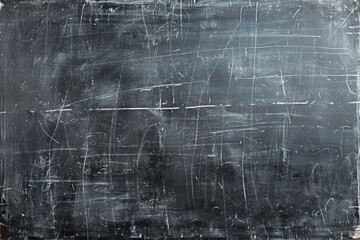 Blank chalkboard with faint chalk dust remnants, providing a classic backdrop for educational or nostalgic themes