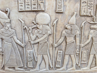 Stone tablet with Egyptian symbols and Egyptian pharaoh figures