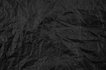 Black crumpled paper texture pattern. Rough grunge old blank.