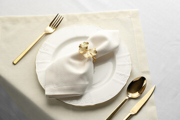 Gold Leaf Napkin Ring on White Plate and Placemat