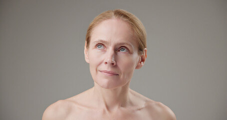 Real people - concept of age, beauty, health and dry skin care - beautiful mature Caucasian...