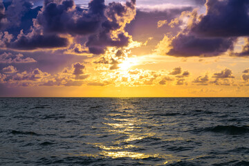 Colorful dramatic sky. Big cloud above ocean. Cloud sky with sea background. Amazing dramatic sky sunset background.
