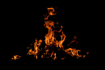 Fire over black background. Fire sparks background. Abstract dark background. Texture of fire on...