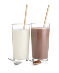 Delicious protein shakes in glasses and spoons with powder isolated on white