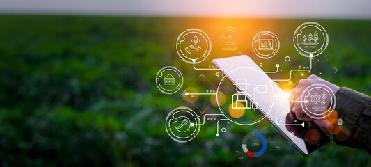 Farmers use agricultural technology in data analysis tablets and image icons. New technologies in agricultural business concepts. Men use tablets to research and develop plant varieties, agricultural