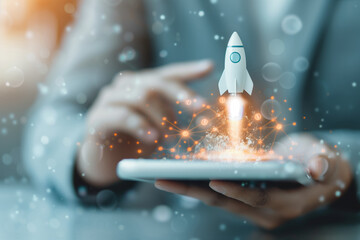 Businessman using digital tablet launching an innovative startup rocket, representing technology, innovation, and business growth.