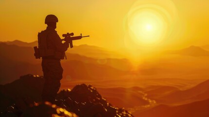 A soldier standing on top of a mountain at sunset, with the orange and purple hues of the sky in the background