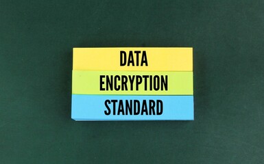 colored paper with the word data encryption standard. the concept of confidential data