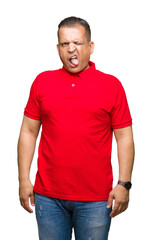Fototapeta premium Middle age arab man over isolated background sticking tongue out happy with funny expression. Emotion concept.