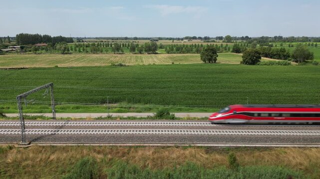Europe, Italy , Milan - Frecciarossa Hight speed 300km h train raylway from Milano  to Rome view from the drone - the faster way to travel in Italy for tourist and passengers - tourist destination 