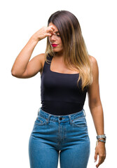 Young beautiful woman over isolated background tired rubbing nose and eyes feeling fatigue and headache. Stress and frustration concept.