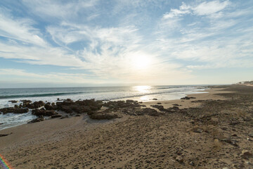 wide-angle view of the beaches south of Arica, on the Pacific Ocean, with a clear sky, rough seas and no people around