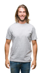 Obraz premium Young handsome man with long hair over isolated background with a happy and cool smile on face. Lucky person.
