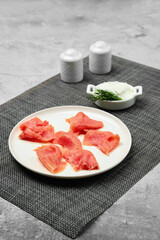 Slices of smoked pink salmon on a plate