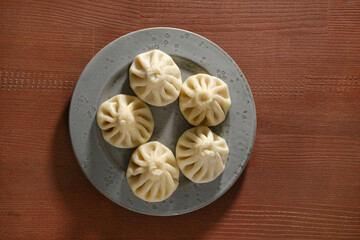 Overhead view of a plate with traditional Georgian dish khinkali