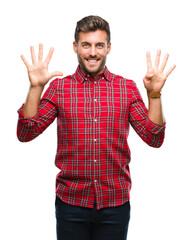 Fototapeta premium Young handsome man over isolated background showing and pointing up with fingers number nine while smiling confident and happy.