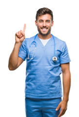 Young handsome doctor surgeon man over isolated background showing and pointing up with finger number one while smiling confident and happy.