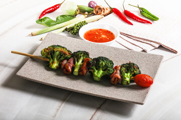 Thai Street foof satay with bacon and broccoli