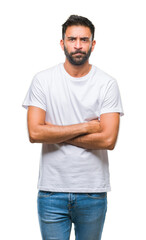 Obraz premium Adult hispanic man over isolated background skeptic and nervous, disapproving expression on face with crossed arms. Negative person.