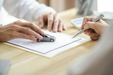 Loss Adjuster Insurance Agent Inspecting Damaged Car. .Sales manager giving advice application form...